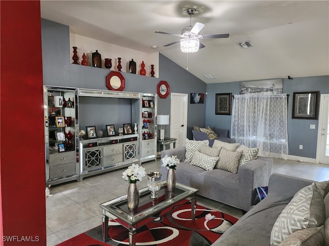 tiled living room featuring ceiling fan and vaulted ceiling