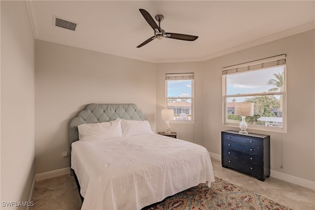 tiled bedroom with ceiling fan and ornamental molding