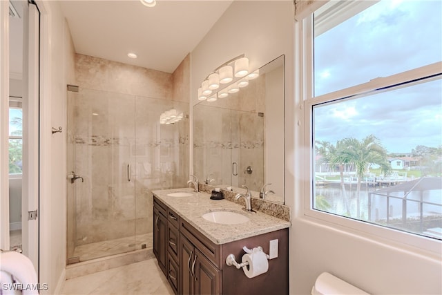 bathroom with tile patterned floors, an enclosed shower, and vanity