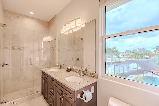 bathroom featuring tile patterned flooring, walk in shower, toilet, and vanity