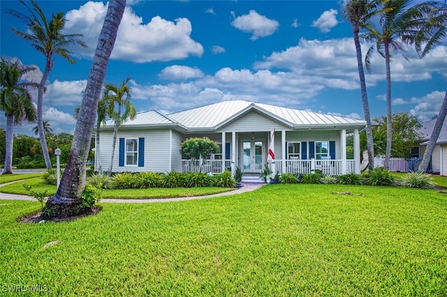 view of front facade with a porch and a front lawn