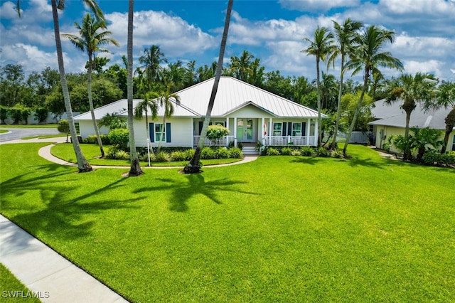 view of front of house with covered porch and a front lawn