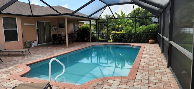 view of pool with a lanai and a patio area