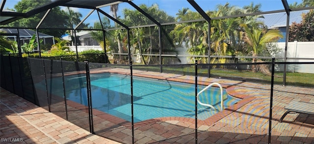 view of swimming pool with a lanai and a patio