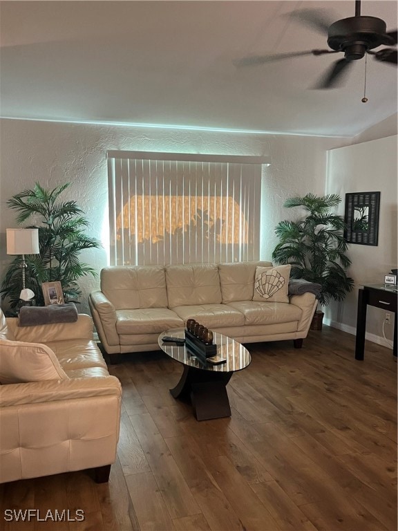 living room with ceiling fan and dark hardwood / wood-style floors