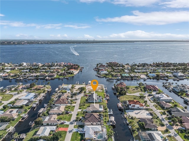 aerial view with a water view and a residential view