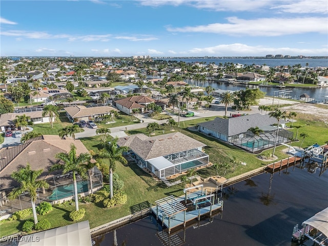 aerial view with a water view and a residential view