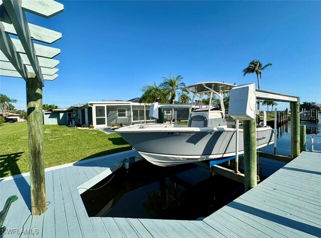 view of dock featuring a yard and a water view