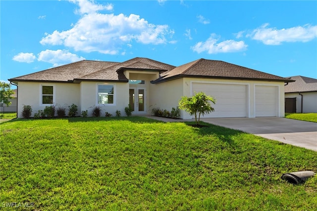 prairie-style home featuring a garage, stucco siding, concrete driveway, and a front yard