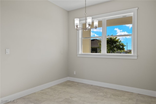 unfurnished room featuring light tile patterned flooring and a chandelier