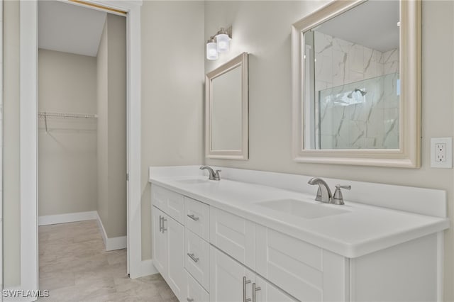 bathroom featuring a shower, vanity, and tile patterned floors