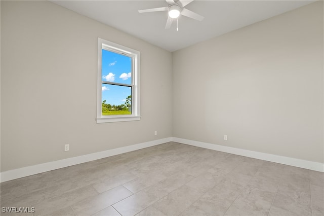 unfurnished room featuring ceiling fan and light tile patterned floors