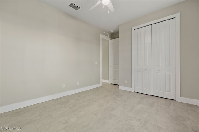 unfurnished bedroom with a closet, ceiling fan, and light tile patterned floors