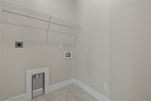 laundry room featuring electric dryer hookup, light tile patterned flooring, and hookup for a washing machine