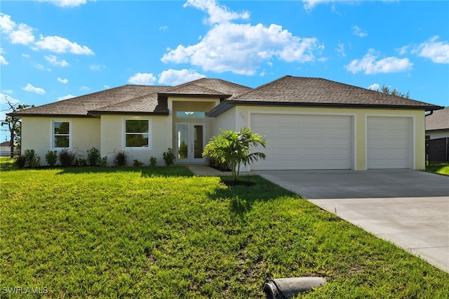 view of front of house with a garage and a front yard