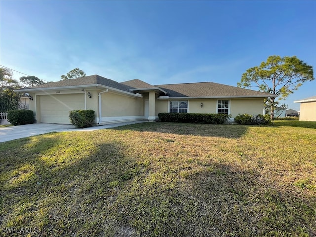 ranch-style house featuring a front lawn and a garage