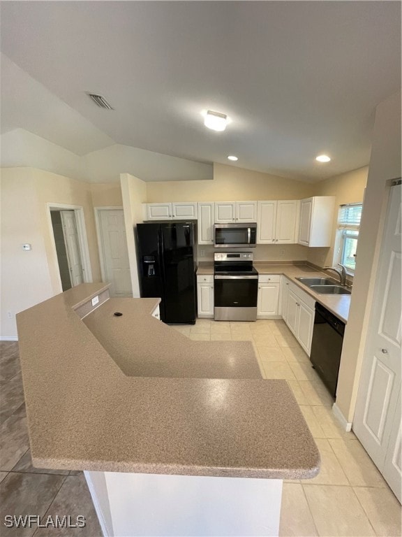 kitchen featuring vaulted ceiling, white cabinetry, light tile patterned floors, sink, and black appliances