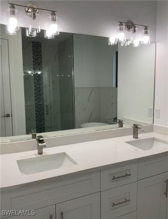 bathroom with vanity and walk in shower