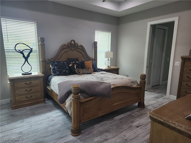 bedroom with hardwood / wood-style flooring