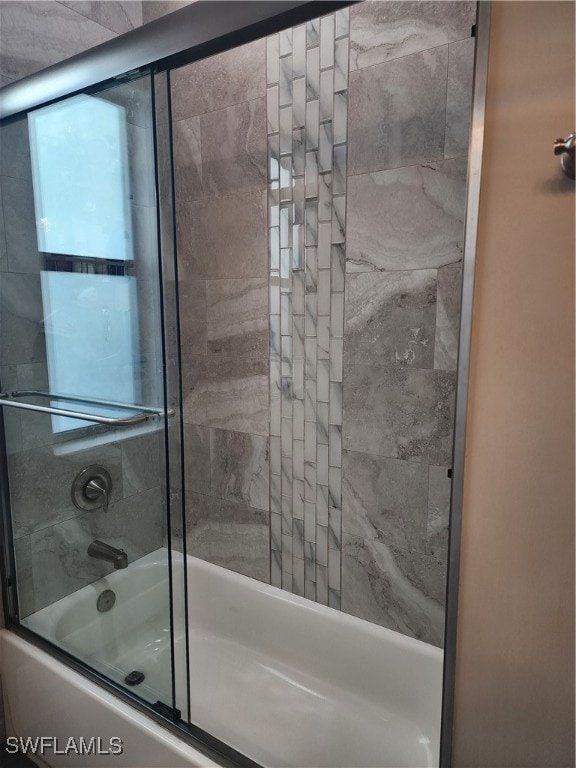 bathroom featuring enclosed tub / shower combo