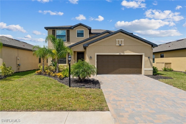 view of front of house featuring a garage and a front yard