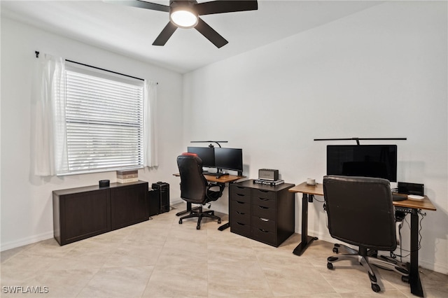 tiled office featuring ceiling fan