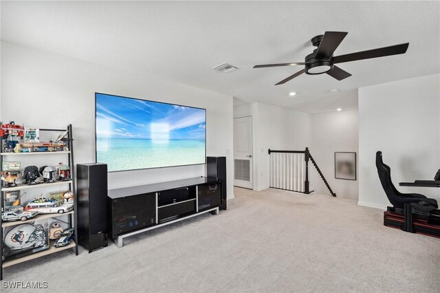 interior space with ceiling fan and light carpet