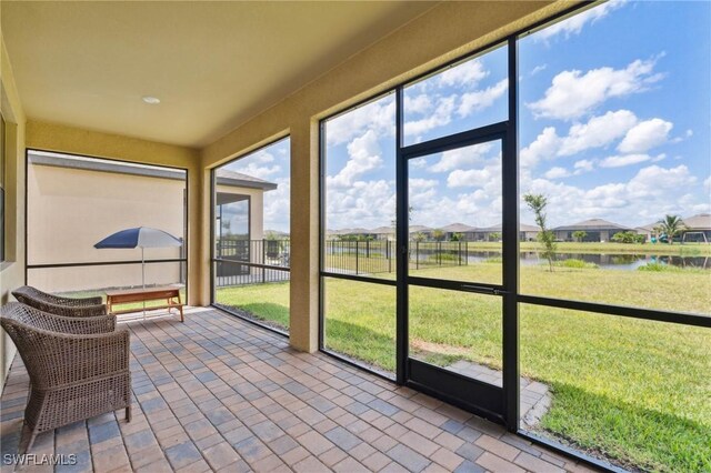 sunroom with a water view