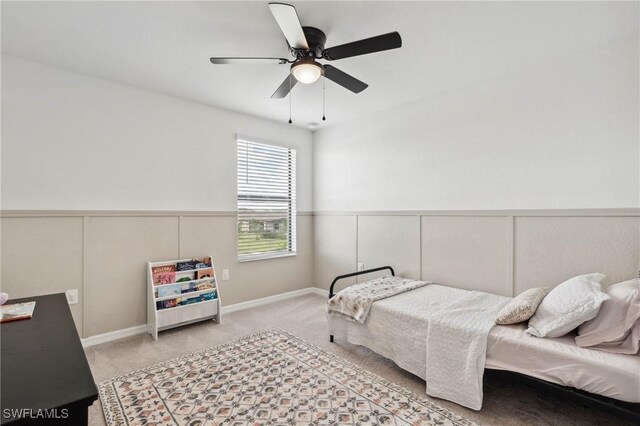 bedroom with ceiling fan and light carpet