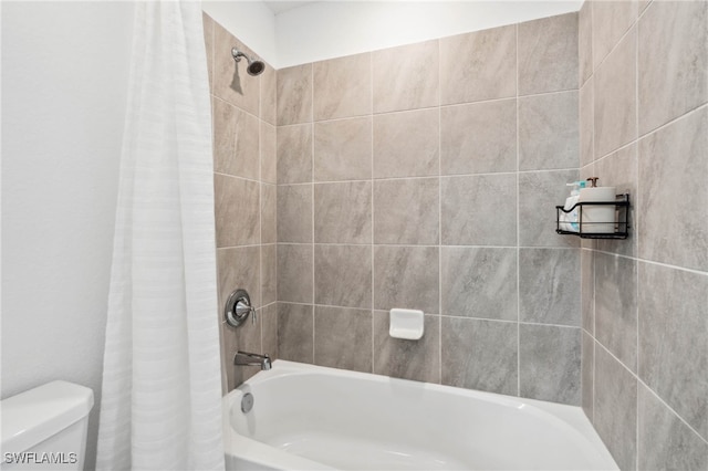 bathroom with shower / bath combo and toilet