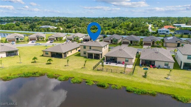 birds eye view of property with a water view