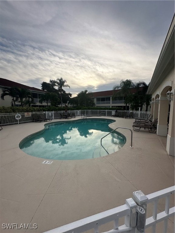 view of swimming pool with a patio area