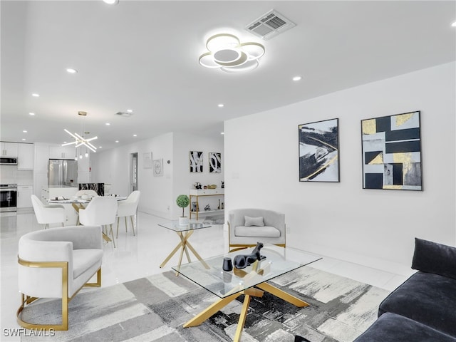 living room with an inviting chandelier