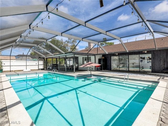 view of pool with a lanai and a patio area