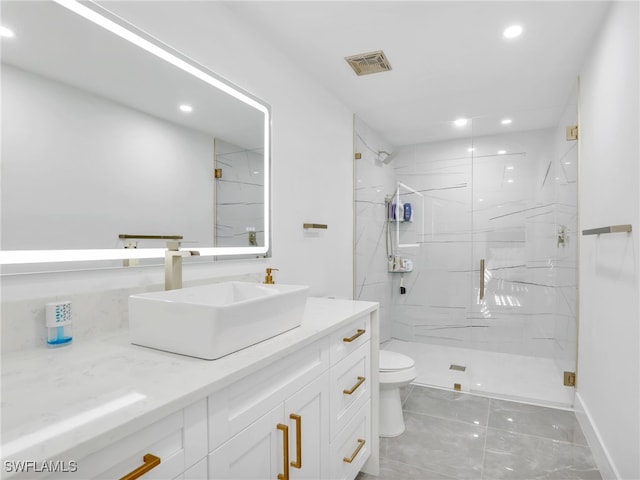 bathroom with vanity, an enclosed shower, and toilet