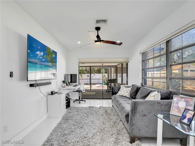 living room featuring tile patterned flooring and ceiling fan