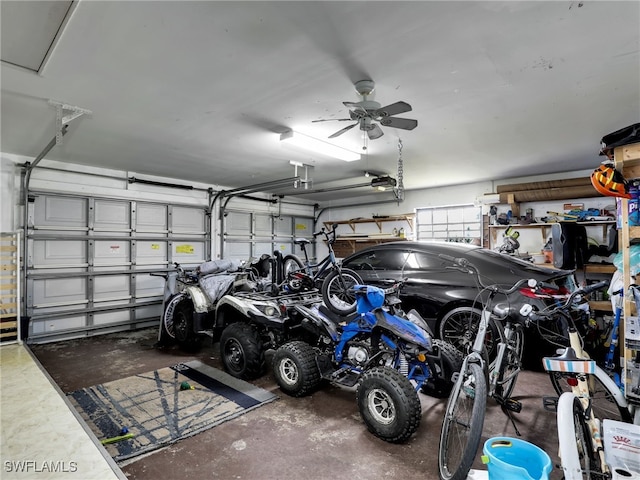 garage featuring a garage door opener and ceiling fan