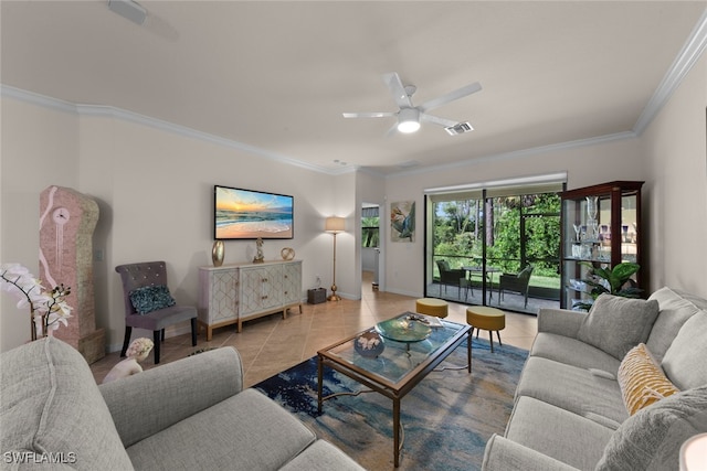 tiled living area featuring visible vents, baseboards, ceiling fan, and crown molding