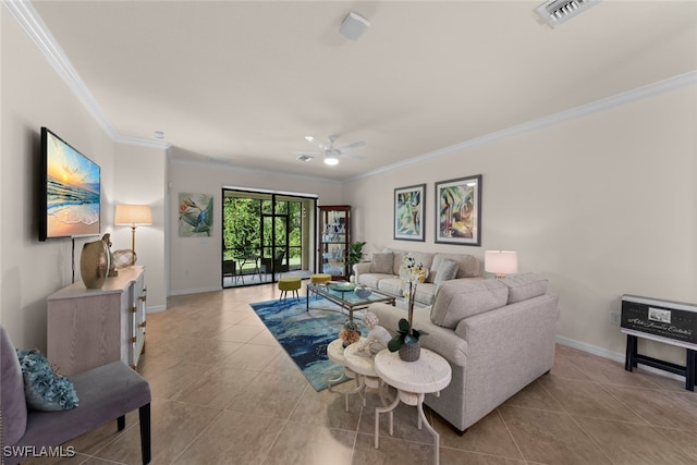 tiled living room with visible vents, baseboards, a ceiling fan, and crown molding