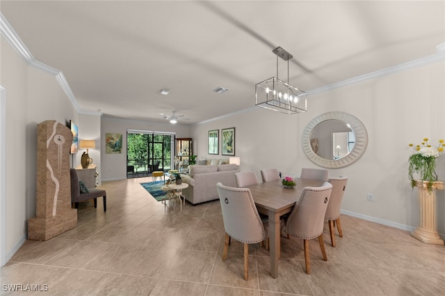 dining room featuring visible vents, ornamental molding, ceiling fan with notable chandelier, light tile patterned floors, and baseboards