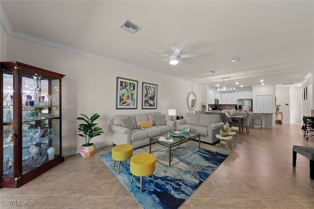 living area with light tile patterned floors, visible vents, crown molding, and baseboards