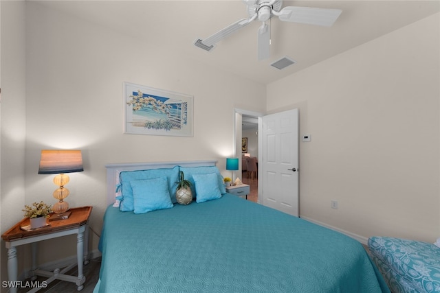 bedroom with a ceiling fan, visible vents, and baseboards