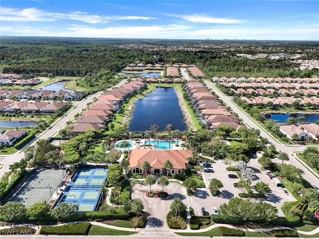 drone / aerial view featuring a water view and a residential view