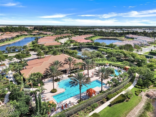 drone / aerial view with a water view and a residential view