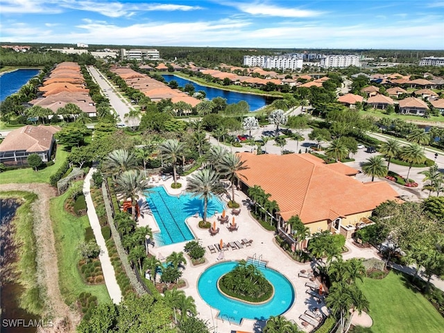 birds eye view of property with a water view