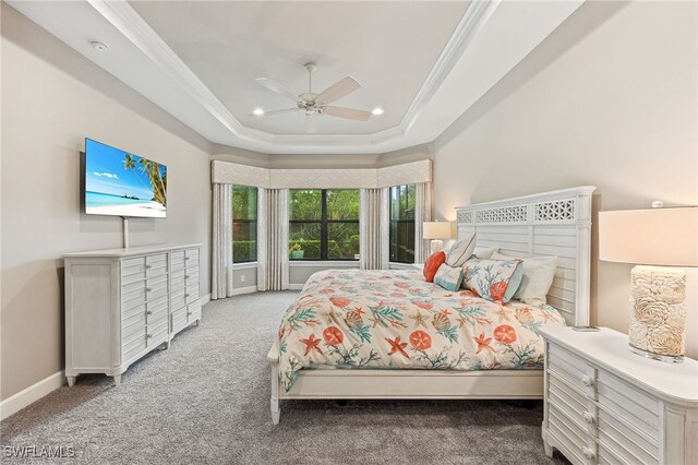 bedroom with light carpet, a raised ceiling, crown molding, and recessed lighting