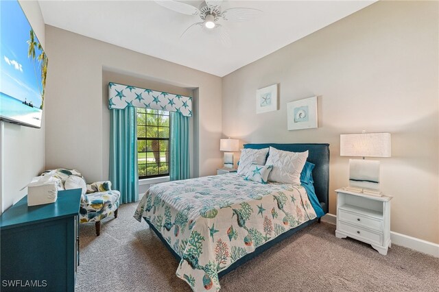 carpeted bedroom with baseboards and a ceiling fan