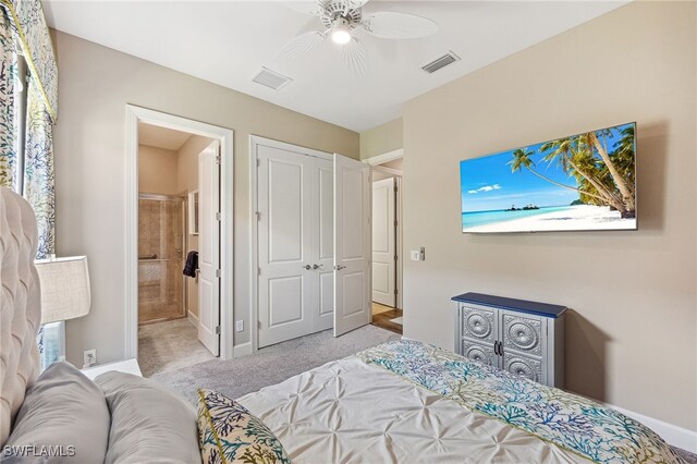 bedroom featuring baseboards, connected bathroom, visible vents, and light colored carpet