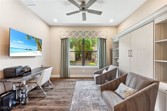 office featuring baseboards, visible vents, dark wood-style flooring, and recessed lighting