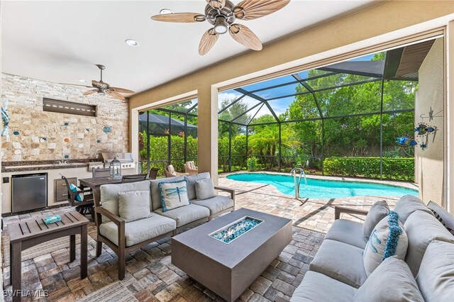 living room featuring brick floor, recessed lighting, a sunroom, and ceiling fan